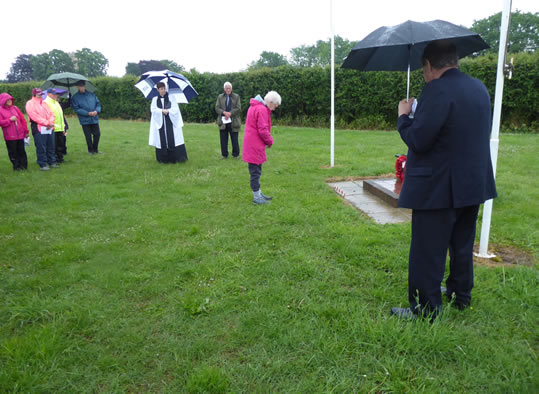 Judith Dobson after placing one of the twelve crosses